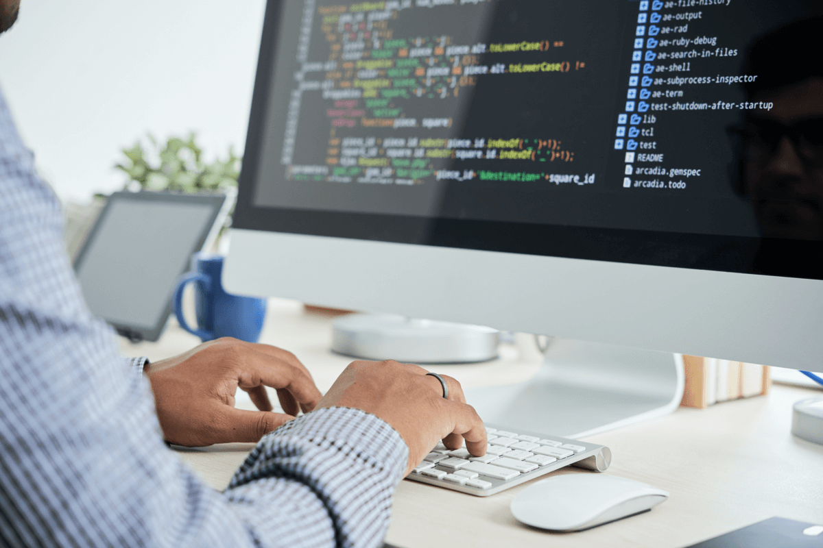 Man coding on a computer